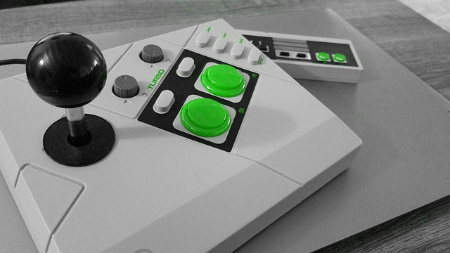 arcade stick with green buttons